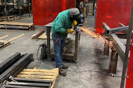 Welder welding with sparks at TAB Industries, Reading, PA